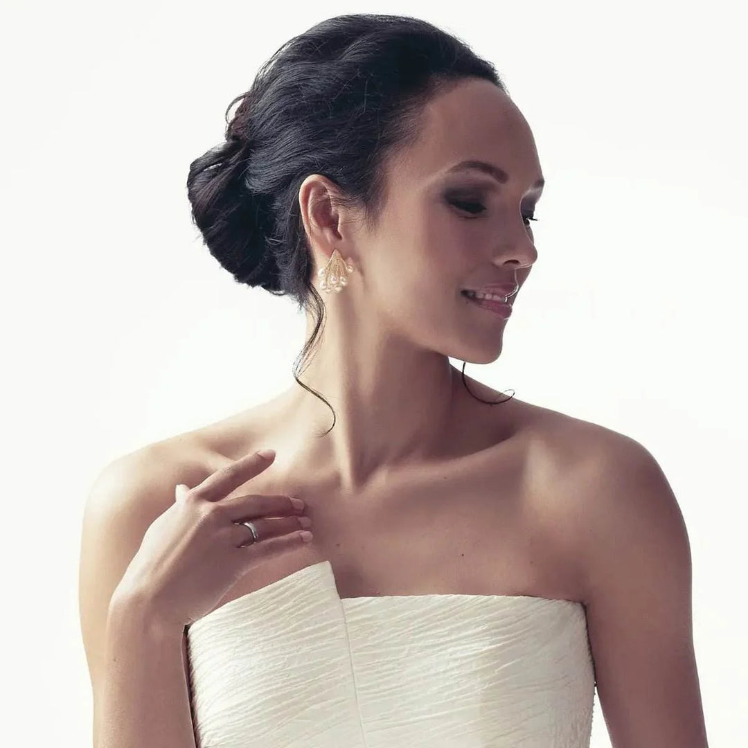 Gold-colored cluster earrings with pearls and zirconias