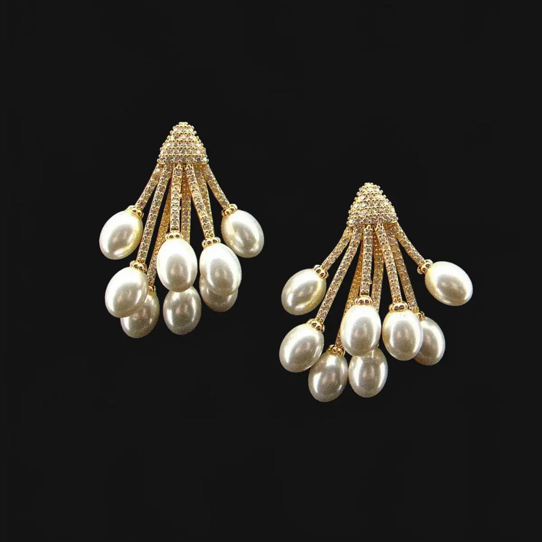 Gold-colored cluster earrings with pearls and zirconias