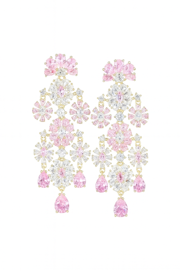 Gold-colored long flower-shaped earrings with pink zirconias