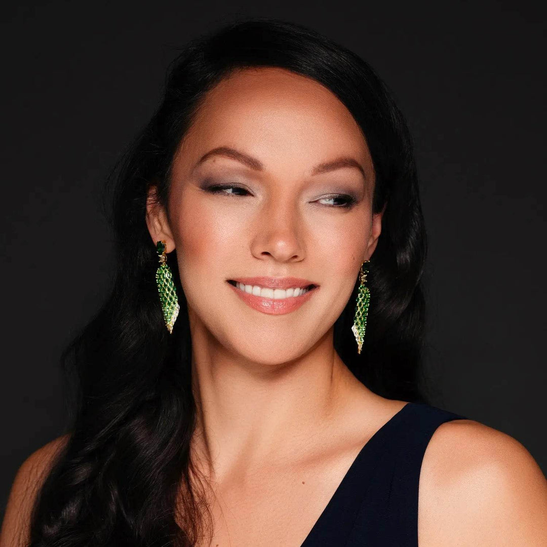 Gold-colored leaf earrings with green zirconia