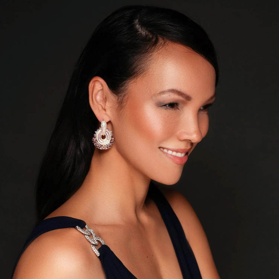 Rose gold-colored earrings with pink zirconias