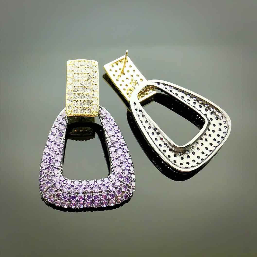 Gold-colored earrings with purple and yellow zirconias