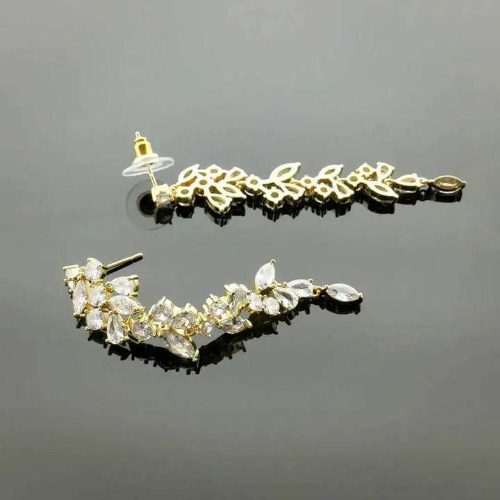 Gold-colored leaf dance earrings with zirconia