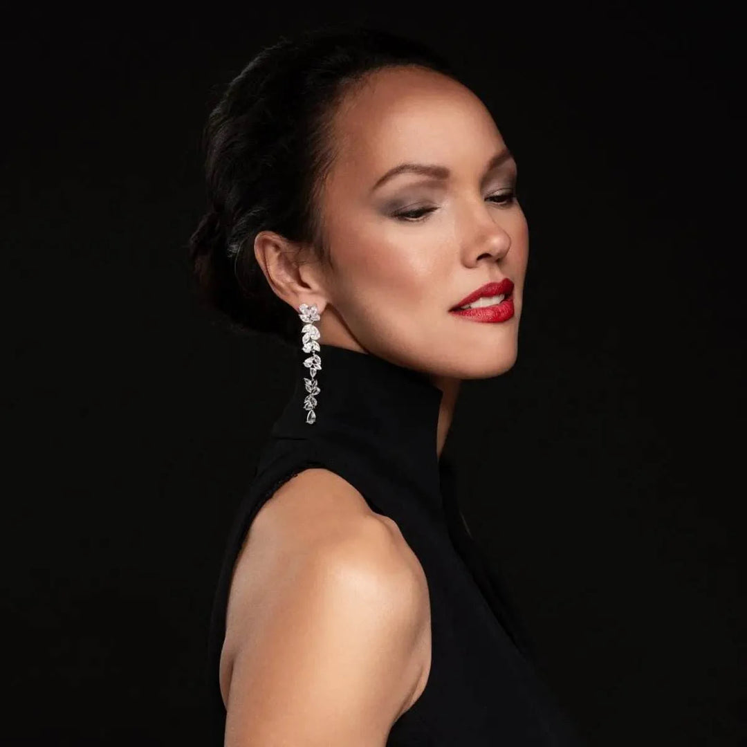 Silver-colored long leaf earrings with zirconia