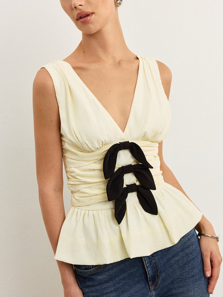 Bow-Detail Ruched Top with Peplum Hem