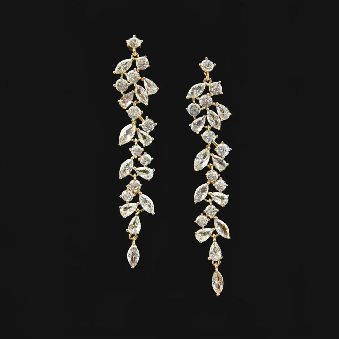 Gold-colored leaf dance earrings with zirconia