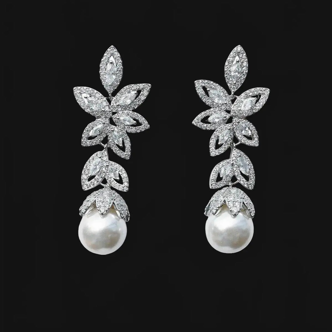 Silver-colored flower earrings with pearls and zirconias