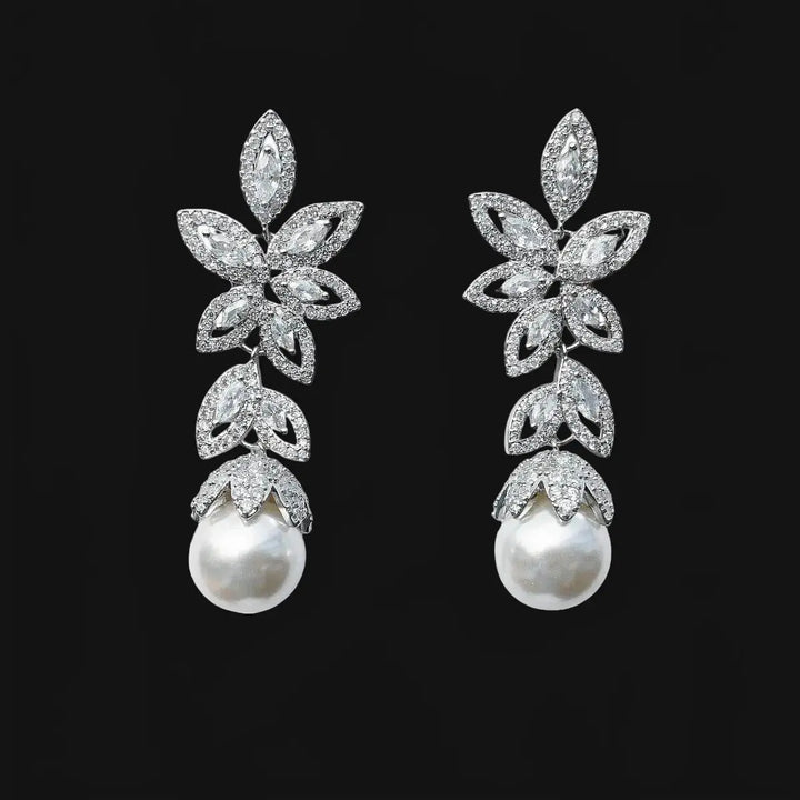 Silver-colored flower earrings with pearls and zirconias