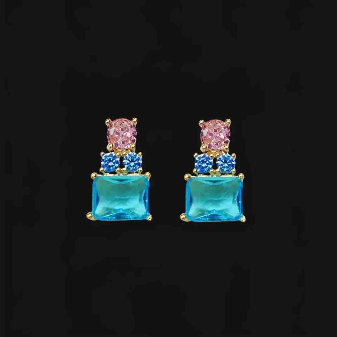 Gold-colored earrings with pink and blue zirconias