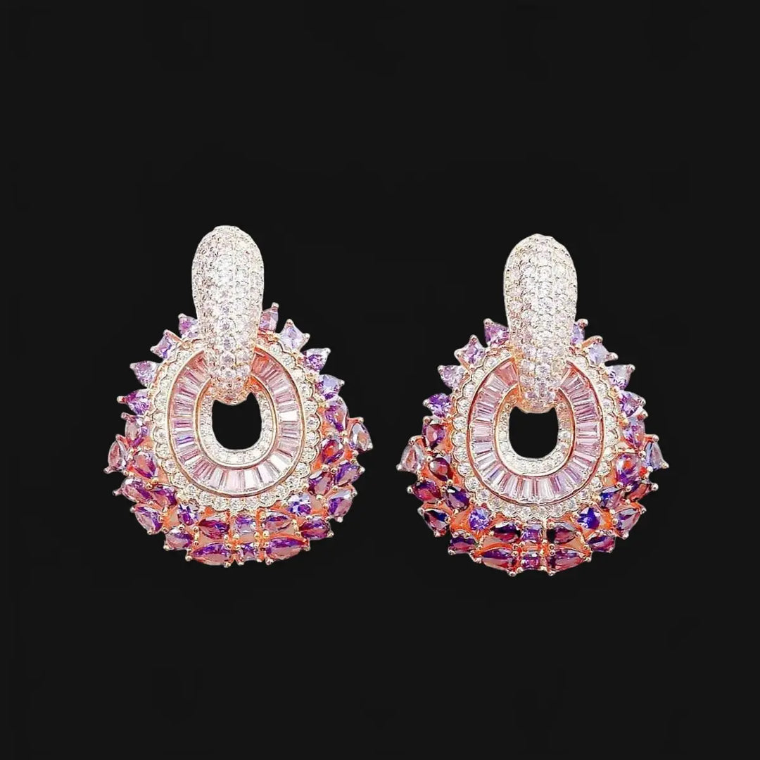 Rose gold-colored earrings with pink zirconias