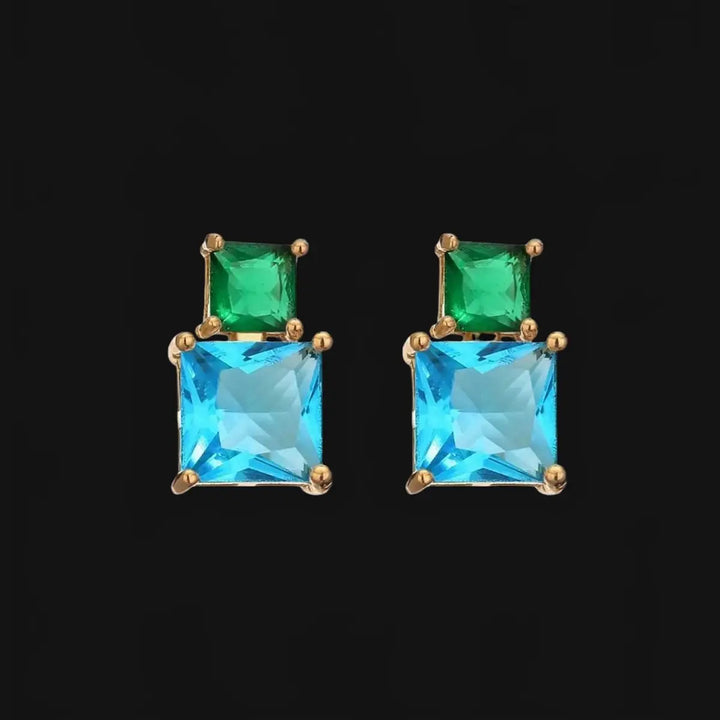 Gold-colored earrings with blue and green zirconias