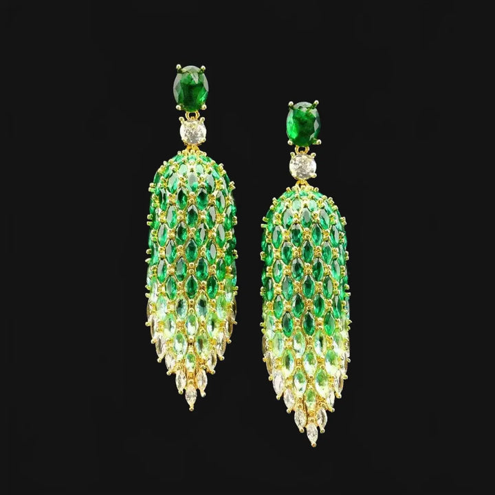 Gold-colored leaf earrings with green zirconia